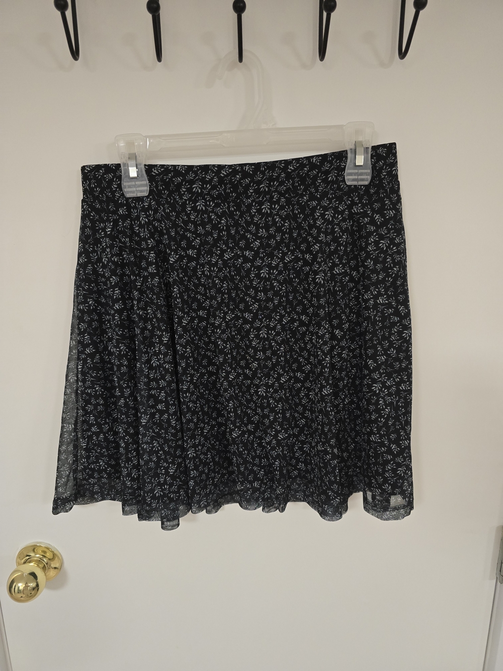 Ardene Black Mini Skirt with White Ditsy Floral Print